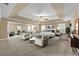 Large staged main bedroom with tray ceiling, seating area, and plenty of natural light at 4499 Bellemeade Dr, Douglasville, GA 30135