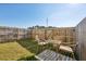 Cozy fenced backyard with patio area and outdoor seating, perfect for relaxing at 5853 Greystone Dr, Lithonia, GA 30058