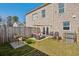 Large fenced backyard featuring a patio, outdoor seating, and a well-maintained lawn at 5853 Greystone Dr, Lithonia, GA 30058