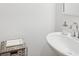 Bright half bathroom with a modern vanity and a clean aesthetic at 5853 Greystone Dr, Lithonia, GA 30058