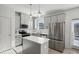 Modern kitchen featuring stainless steel appliances and a bright island at 5853 Greystone Dr, Lithonia, GA 30058