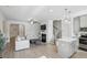Open-concept living room with a modern kitchen, island, and stainless steel appliances at 5853 Greystone Dr, Lithonia, GA 30058
