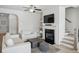 Bright living room with open space, fireplace and stairs at 5853 Greystone Dr, Lithonia, GA 30058