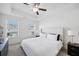 Inviting primary bedroom featuring tray ceilings, neutral decor, and ample natural light at 5853 Greystone Dr, Lithonia, GA 30058