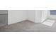 Upstairs room featuring neutral carpeting and a window for natural light at 5853 Greystone Dr, Lithonia, GA 30058