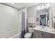 Bathroom features subway tile shower, modern vanity, and is well-lit, creating a clean and inviting space at 613 Brennan Dr, Decatur, GA 30033