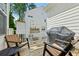 Cozy deck featuring wooden chairs, a grill, and a charming flower box, perfect for outdoor relaxation at 613 Brennan Dr, Decatur, GA 30033
