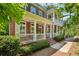 Beautiful brick townhome with inviting porch, stairs, and manicured landscaping at 613 Brennan Dr, Decatur, GA 30033