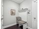 Comfortable mudroom with a built-in bench, storage hooks, decorative prints, and seamless transition to the home's interior at 613 Brennan Dr, Decatur, GA 30033