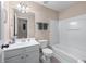 Well-lit bathroom with a single vanity and a shower-tub combination at 661 Village Field Nw Ct, Suwanee, GA 30024