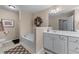 Bathroom featuring shower, soaking tub, neutral color palette, and decorative floral wreath at 661 Village Field Nw Ct, Suwanee, GA 30024