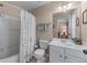 Bathroom featuring a tub, shower, and single sink with vanity and decorative towels at 661 Village Field Nw Ct, Suwanee, GA 30024