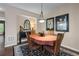 Dining room featuring wood chairs and an oval table with floral artwork on the wall at 661 Village Field Nw Ct, Suwanee, GA 30024
