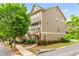 Charming townhome with well-maintained landscaping, inviting entrance, and a manicured lawn at 661 Village Field Nw Ct, Suwanee, GA 30024