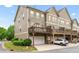 Charming townhome featuring an attached garage and a private deck, perfect for relaxing outdoors at 661 Village Field Nw Ct, Suwanee, GA 30024