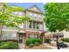 Charming townhome featuring a well-manicured front yard and inviting facade at 661 Village Field Nw Ct, Suwanee, GA 30024