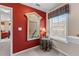 Hallway nook with window seat and decorative mirror leading to adjacent bedroom at 661 Village Field Nw Ct, Suwanee, GA 30024