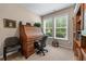 Bright office space with a classic roll-top desk and ample natural light at 661 Village Field Nw Ct, Suwanee, GA 30024