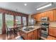 Bright kitchen with granite countertops, stainless steel appliances, and light-filled breakfast nook at 661 Village Field Nw Ct, Suwanee, GA 30024