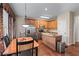 Cozy eat-in kitchen with stainless steel appliances, granite countertops, and wood cabinetry at 661 Village Field Nw Ct, Suwanee, GA 30024