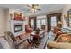 Comfortable living room with a fireplace, hardwood floors, and elegant decor at 661 Village Field Nw Ct, Suwanee, GA 30024