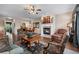 Open concept living space with fireplace, dining area, and comfortable seating at 661 Village Field Nw Ct, Suwanee, GA 30024