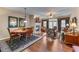 Open concept living space with a fireplace, dining table and seating area at 661 Village Field Nw Ct, Suwanee, GA 30024