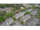 Overhead shot of complex showing roof lines, landscaping, parking, and nearby buildings at 3107 Woodland Ln, Alpharetta, GA 30009