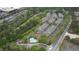 An aerial view of townhomes with a pool and green space in a residential community at 3107 Woodland Ln, Alpharetta, GA 30009