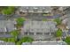 An overhead aerial view of townhome roofs, driveways, and lush, green landscaping at 3107 Woodland Ln, Alpharetta, GA 30009