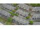Aerial view of complex showing roof lines, landscaping and parking areas at 3107 Woodland Ln, Alpharetta, GA 30009