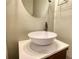 Bathroom featuring a modern vessel sink, stylish faucet, and a unique mirror at 3107 Woodland Ln, Alpharetta, GA 30009