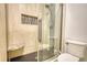 Bathroom featuring a tiled shower with glass door and a corner seat, for a spa-like experience at 3107 Woodland Ln, Alpharetta, GA 30009