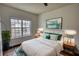 Bright bedroom with a large window, comfortable bed, and tasteful decor at 3107 Woodland Ln, Alpharetta, GA 30009