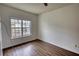 Bright bedroom features hardwood floors and a large window for ample natural light at 3107 Woodland Ln, Alpharetta, GA 30009