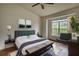 Serene bedroom with a comfortable bed, stylish decor, and a large window providing natural light at 3107 Woodland Ln, Alpharetta, GA 30009