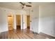 This spacious bedroom features hardwood floors, a ceiling fan, and an ensuite bathroom at 3107 Woodland Ln, Alpharetta, GA 30009