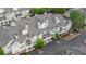 Exterior aerial view of townhome units with chimneys and individual balconies at 3107 Woodland Ln, Alpharetta, GA 30009