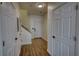 Hallway featuring access to the stairwell and multiple entryways in the home at 3107 Woodland Ln, Alpharetta, GA 30009