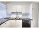 Stylish kitchen with stainless steel appliances, sleek black hardware, and granite countertops at 3107 Woodland Ln, Alpharetta, GA 30009