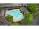 Aerial shot of a community pool featuring a unique design, complemented by manicured landscaping and parking at 3107 Woodland Ln, Alpharetta, GA 30009
