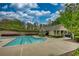 Community swimming pool with a modern design and comfortable lounge area at 3107 Woodland Ln, Alpharetta, GA 30009