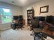 Bedroom featuring a home office setup with a natural light-filled window and two personal computer stations at 3236 Grove Nw Trl, Acworth, GA 30101