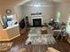 Open-concept living room with hardwood floors, fireplace, and view of the kitchen from the top of the staircase at 3236 Grove Nw Trl, Acworth, GA 30101
