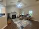Bright and airy living room with vaulted ceilings, a fireplace, and hardwood floors, great for relaxing and entertaining at 3236 Grove Nw Trl, Acworth, GA 30101