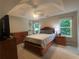 Comfortable main bedroom featuring a ceiling fan, dresser, and natural light from the backyard-facing windows at 3236 Grove Nw Trl, Acworth, GA 30101