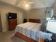 Spacious main bedroom with a ceiling fan, dresser, and plush carpeted floors perfect for relaxation at 3236 Grove Nw Trl, Acworth, GA 30101