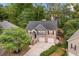 Aerial view of a charming two-story house with a two car garage and landscaping at 3607 Anna Nw Ln, Kennesaw, GA 30144