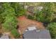 Aerial view of a home and yard featuring a trampoline, lush greenery, and patio area at 3607 Anna Nw Ln, Kennesaw, GA 30144