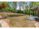Expansive backyard with a stock tank pool and covered patio with basketball hoop at 3607 Anna Nw Ln, Kennesaw, GA 30144
